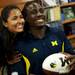 Ann Arbor resident Wilma Woodruff  smiles with Michigan senior quarterback Denard Robinson for a picture at The M-Den in Ann Arbor on Saturday, Feb. 2. Daniel Brenner I AnnArbor.com